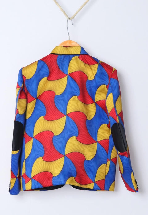 a colorful jacket hanging on a white wall