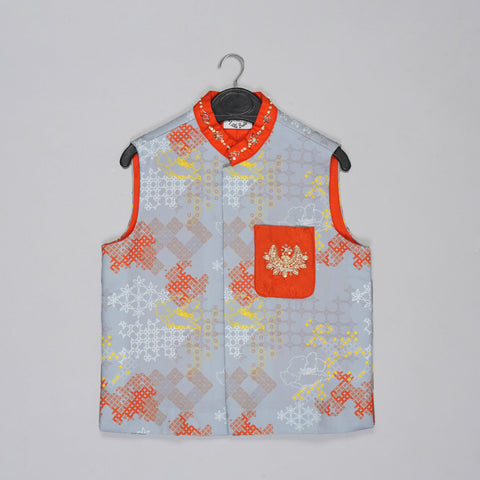 Pre-Order: Orange Kurta With Grey Geometrical Printed Bundi Jacket With Hand Embroidery And Pajama Set