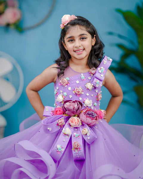 Pre-Order: Lavender twirled gown with multicolored pastel flower embellished yoke and hand crafted bow