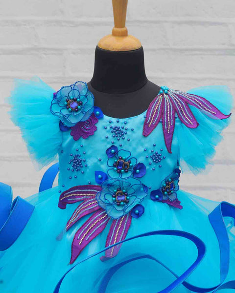 Pre-Order: Aqua blue and Royal blue twirled gown with purple and blue handcrafted flowers and detailing