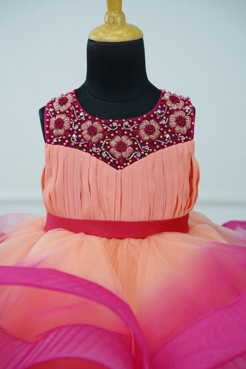 Pre-Order:  Peach And Dark Pink Double Shaded Twirled Partywear Gown with Hand worked Yoke