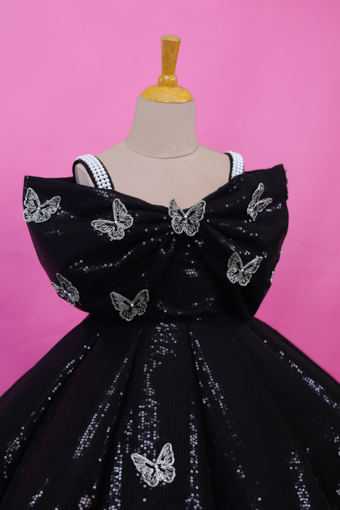 Pre-Order: Black SEQUENCE Panel Gown Highlighted with Handcrafted Silver Butterfly Patches.