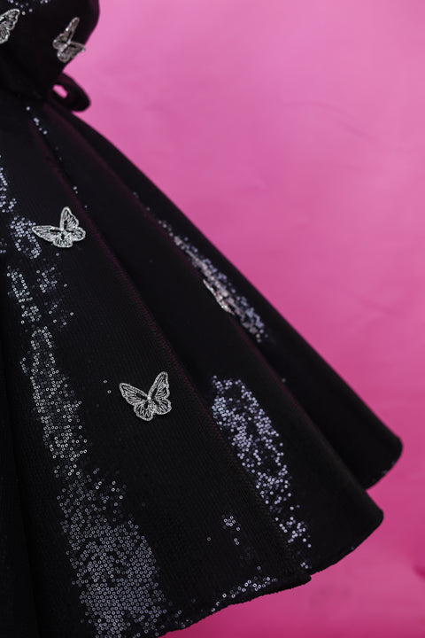 Pre-Order: Black SEQUENCE Panel Gown Highlighted with Handcrafted Silver Butterfly Patches.
