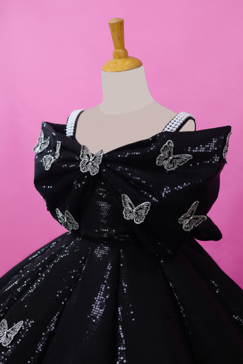 Pre-Order: Black SEQUENCE Panel Gown Highlighted with Handcrafted Silver Butterfly Patches.
