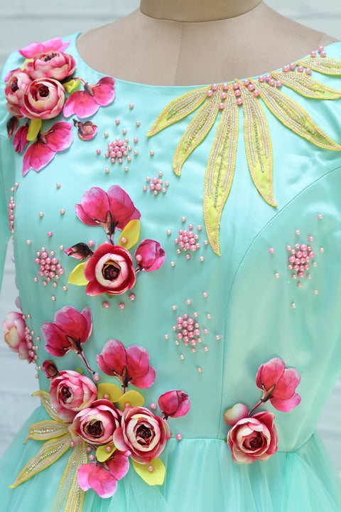 Pre-Order: Pale Aqua Blue Twirled Long Gown with Pink and Yellow Hand-Crafted Flower and Detailing