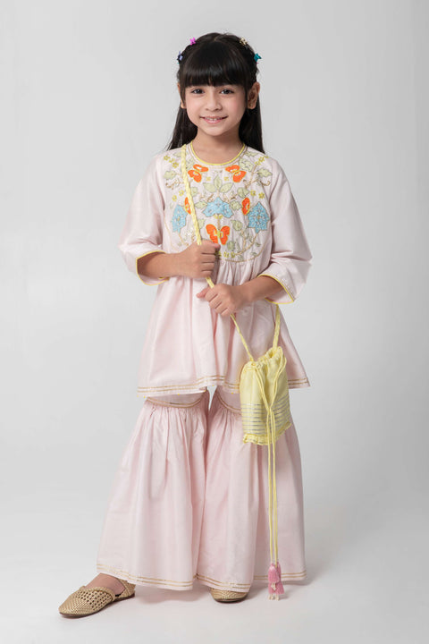 Pre-Order: PASTEL PINK SHARARA WITH PATCHWORK INTRICATE EMBROIDERY. CUTE NEON POTLI ADDED