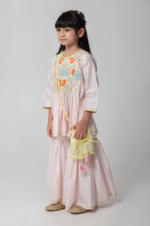 Pre-Order: PASTEL PINK SHARARA WITH PATCHWORK INTRICATE EMBROIDERY. CUTE NEON POTLI ADDED