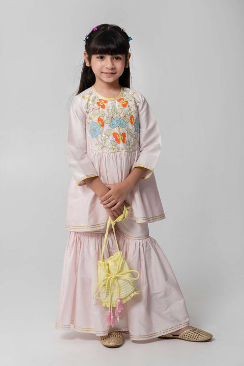 Pre-Order: PASTEL PINK SHARARA WITH PATCHWORK INTRICATE EMBROIDERY. CUTE NEON POTLI ADDED