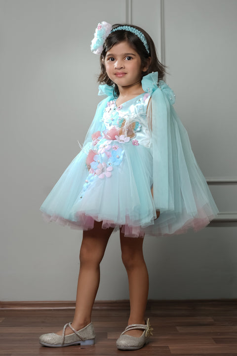 Pre-Order:  Blue Dress Embellished With Handmade Flowers And Shoulder Bow With Net Extension