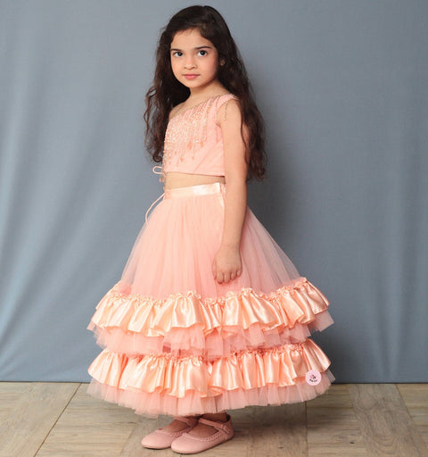Pre-Order: One Shoulder Peach Lehenga Set Embellished with Tassel Lace