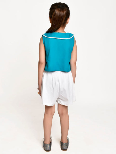 Turquoise Blue lace emblished top with White Shotrs