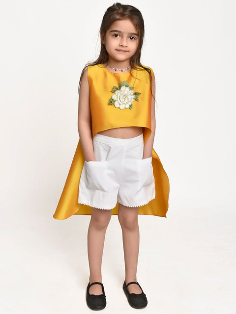 Yellow Asymmetric Flower Emblished top and White shorts