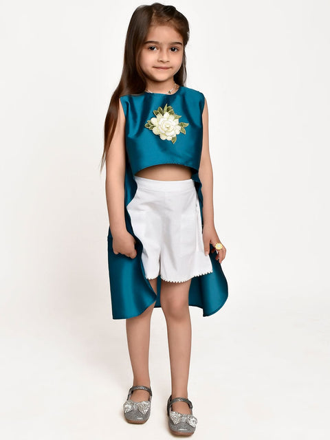 Turquoise Asymmetric Flower Emblished top and White shorts