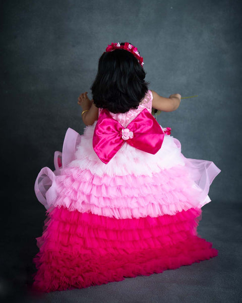 Pre-Order: Baby Pink Twirl Flouncy Gown With Frilled Layerd Trail On Back Side