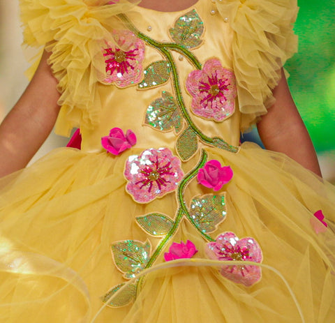 Pre-Order: Sunny Yellow Asymmetrical Swirl Gown With Fuchsia Pink Flower Appliqués