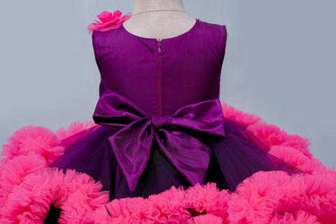 Pre-Order: Purple And Rani Pink Cloudy Frilled Party Wear Gown With Flower Detailing