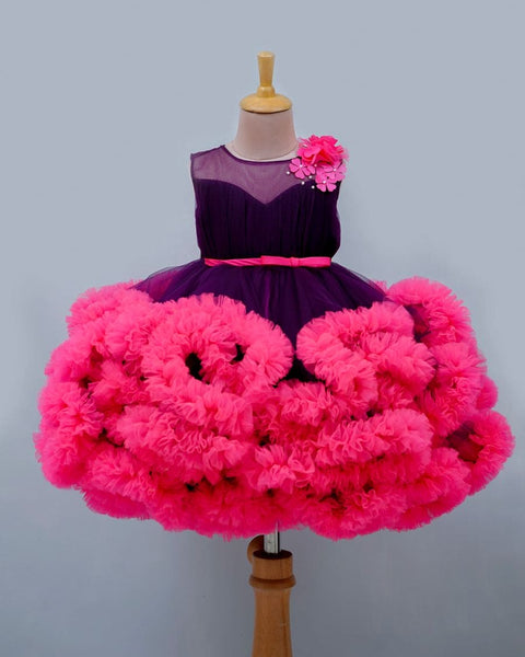 Pre-Order: Purple And Rani Pink Cloudy Frilled Party Wear Gown With Flower Detailing