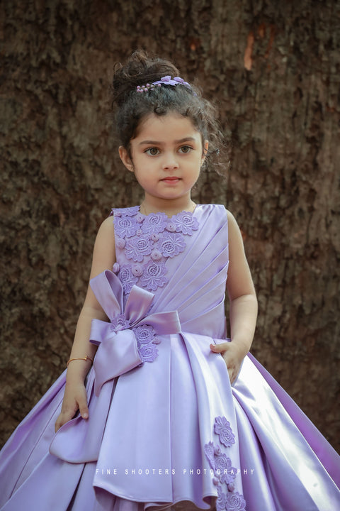 Pre-Order: Lavender Imported Quality Satin Gown With Designer Bow And Flower Applique Work