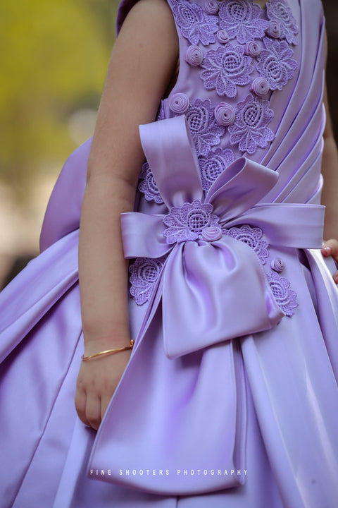 Pre-Order: Lavender Imported Quality Satin Gown With Designer Bow And Flower Applique Work