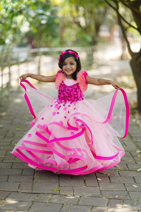 Pre-Order: Dusty Peach Twirled Partywear Gown With Pink And Purple Small Flower