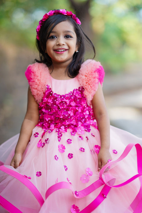 Pre-Order: Dusty Peach Twirled Partywear Gown With Pink And Purple Small Flower