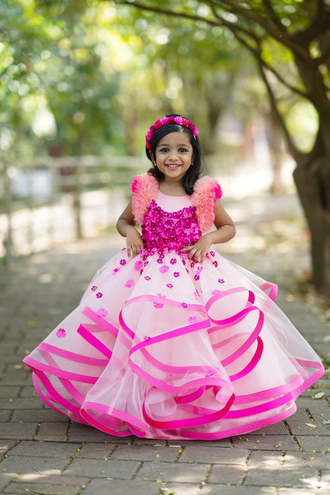 Pre-Order: Dusty Peach Twirled Partywear Gown With Pink And Purple Small Flower