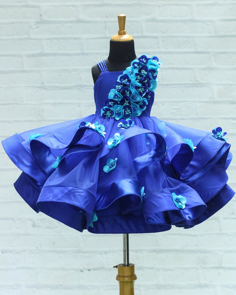 Pre-Order: Royal Blue Swirled One Shoulder Gown With Royal Blue & Sky Blue Flower Work